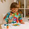 Sort impermeabil pictura pentru copii cu varsta intre 1-3 ani, Multicolor Sort impermeabil pictura pentru copii cu varsta intre 1-3 ani, Multicolor