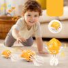 Jucarie interactiva caracatita dansatoare muzicala cu lumini pentru bebelusi si copii KESNUP, + 6 luni, sustine dezvoltarea coordonarii motorii, sistem automat de evitare obstacole, alimentare 3 baterii AAA, dimensiuni 20.7 x 12.6 x 7.6 cm, Portocaliu